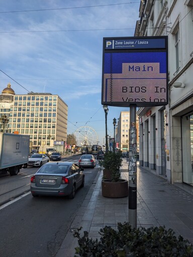 The display of a car garage shows parts of a BIOS menu.